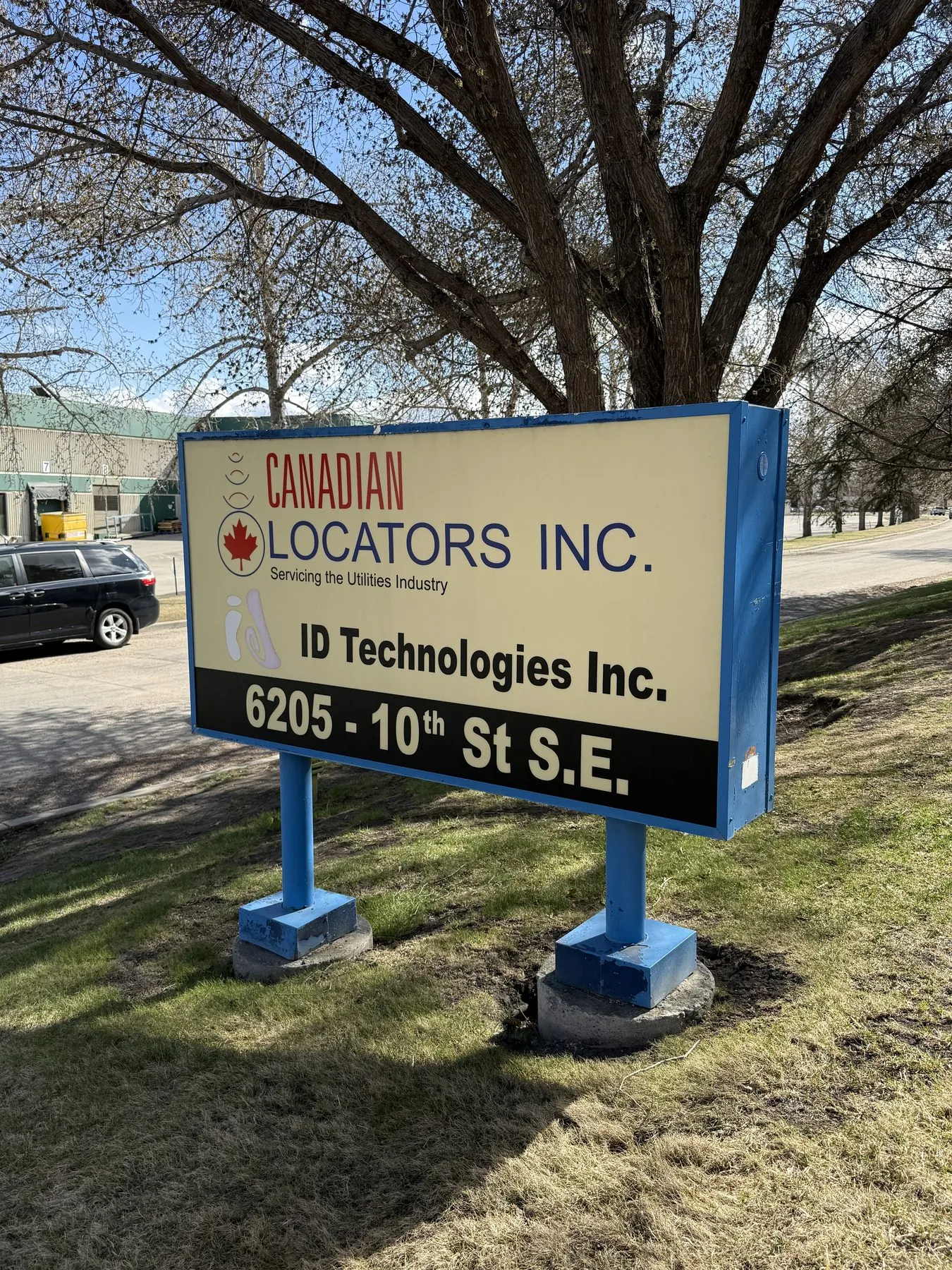 Canadian Locators Inc and ID Technologies signage at 6205 10th Street SE