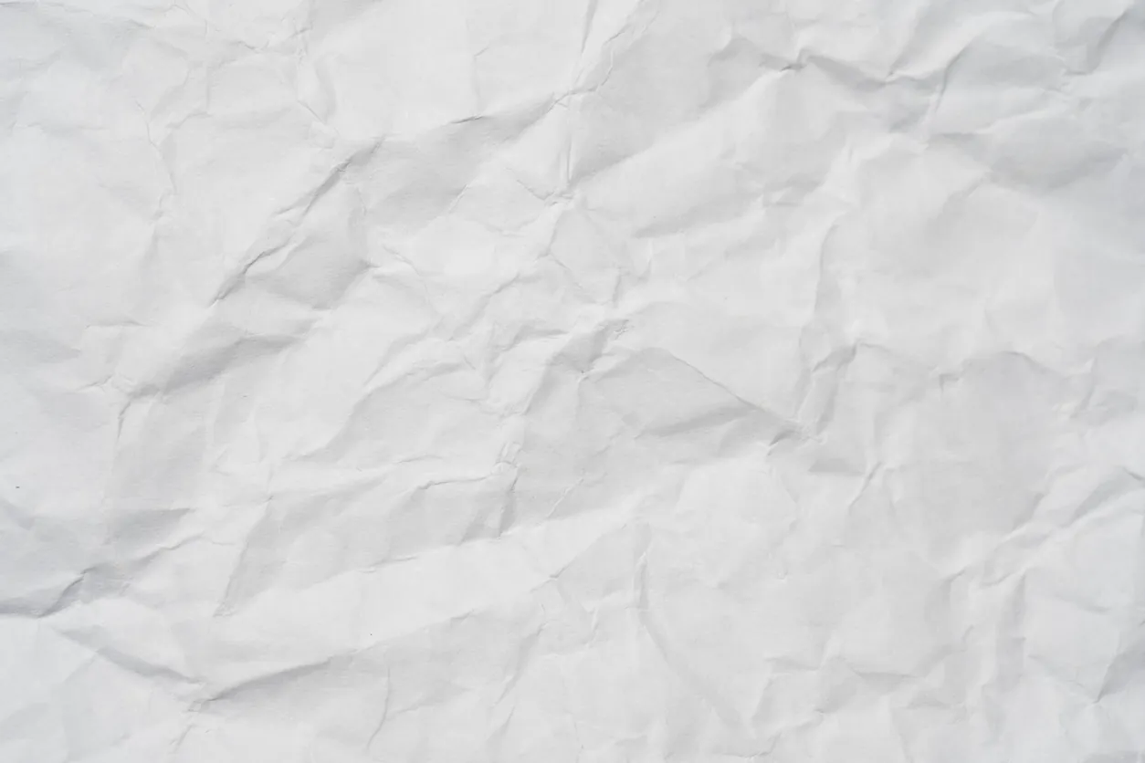 Plain crumpled white paper background